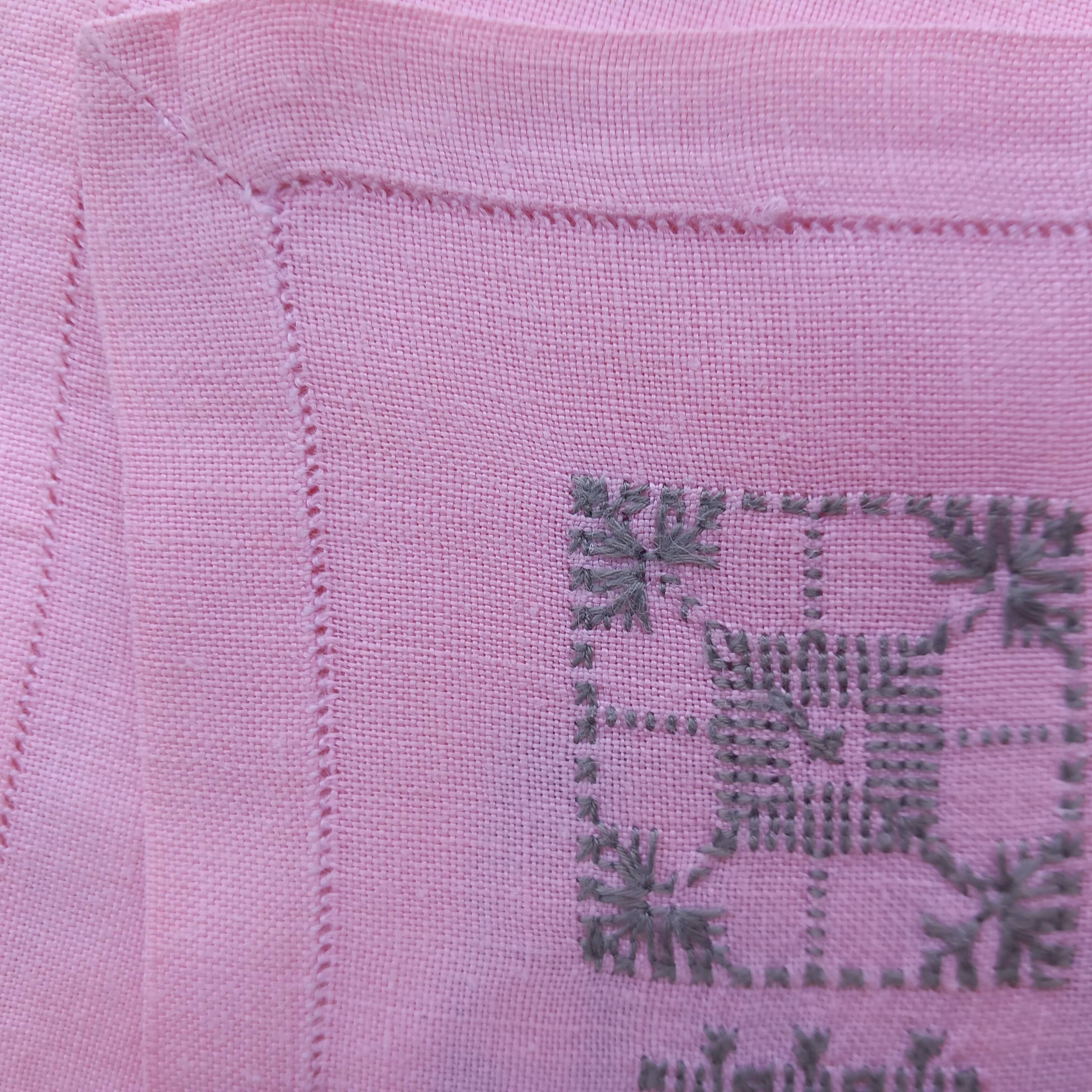 Large vintage linen tablecloth embroidered in pink and 12 matching napkins.
