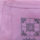 Large vintage linen tablecloth embroidered in pink and 12 matching napkins.