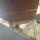 Table de ferme rustique patinée sur de lourds tréteaux