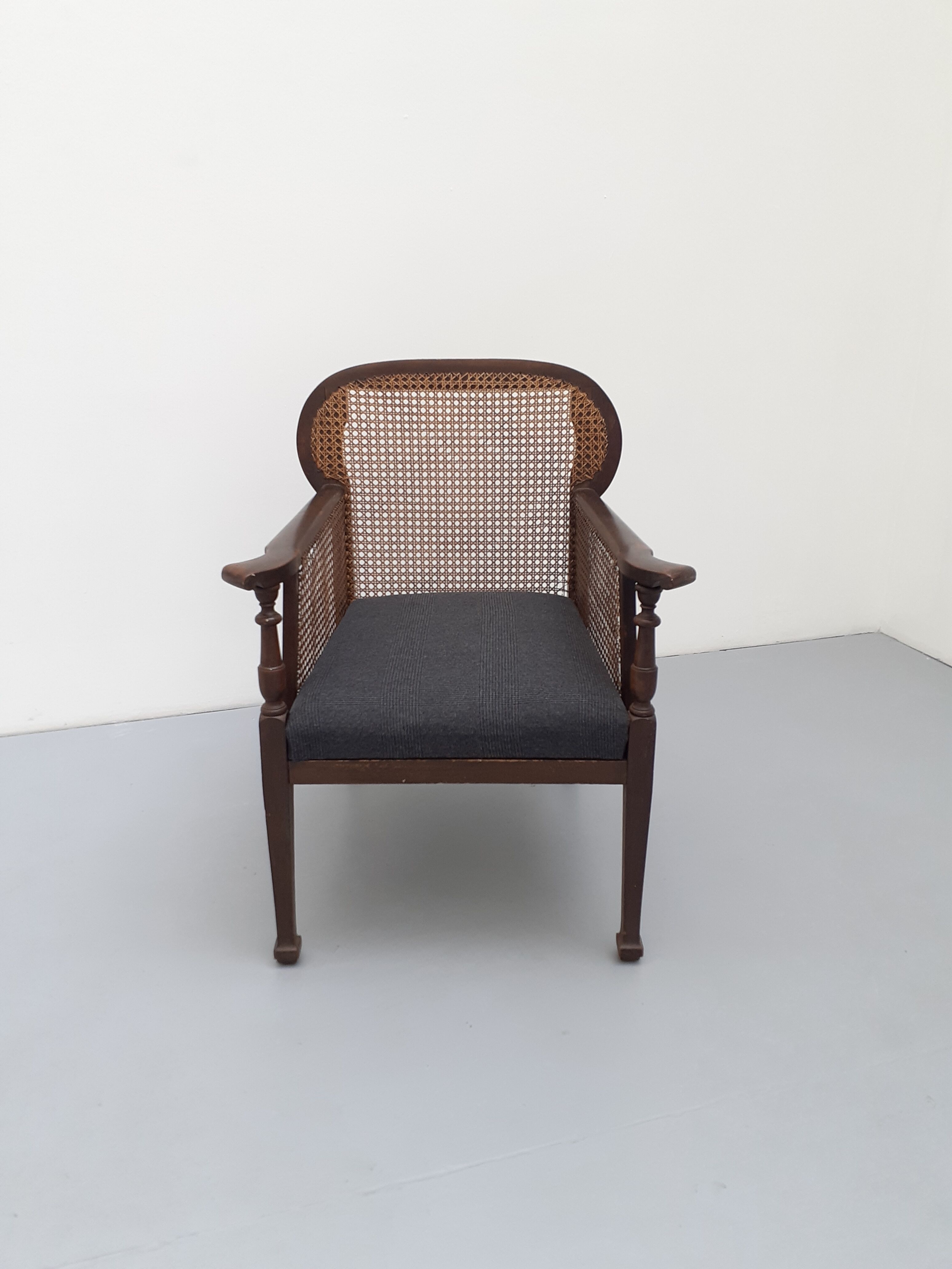 Colonial wooden armchair and cannage