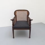 Colonial wooden armchair and cannage