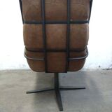 Fauteuil pivotant industriel en cuir cognac