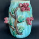 Large turquoise ceramic vase Athezza with raised floral decoration.