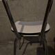 3 white Formica chairs