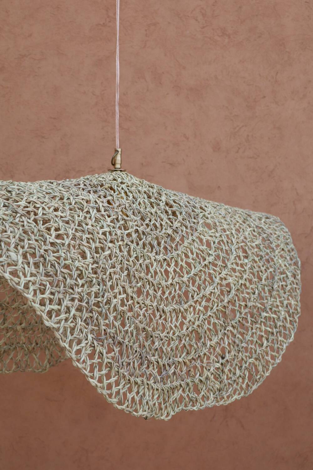 Handmade wicker hanging basket with brass finish