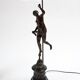 Pair of bronze lamps with red shades
