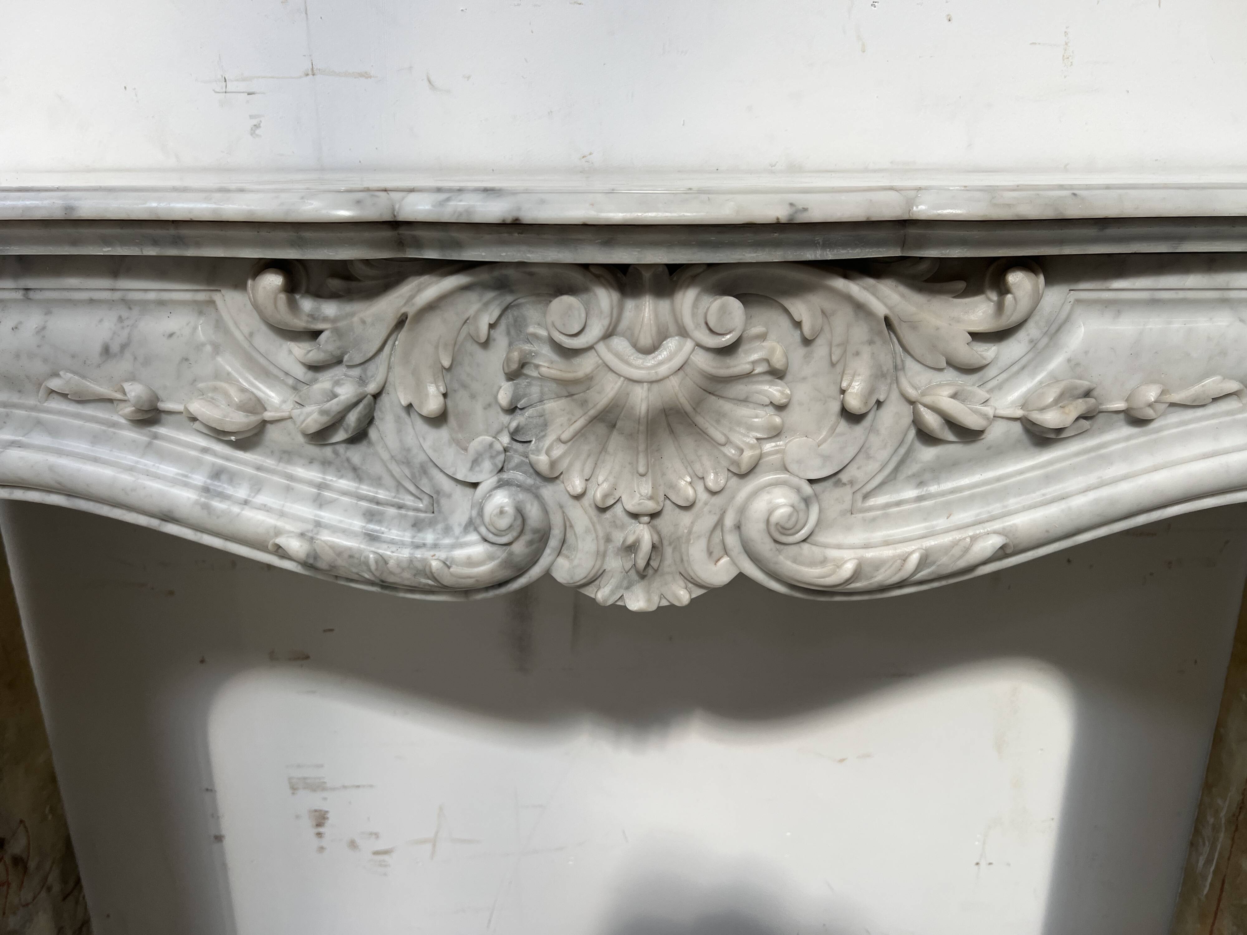 Louis XV style white Carrara marble fireplace, 19th century.