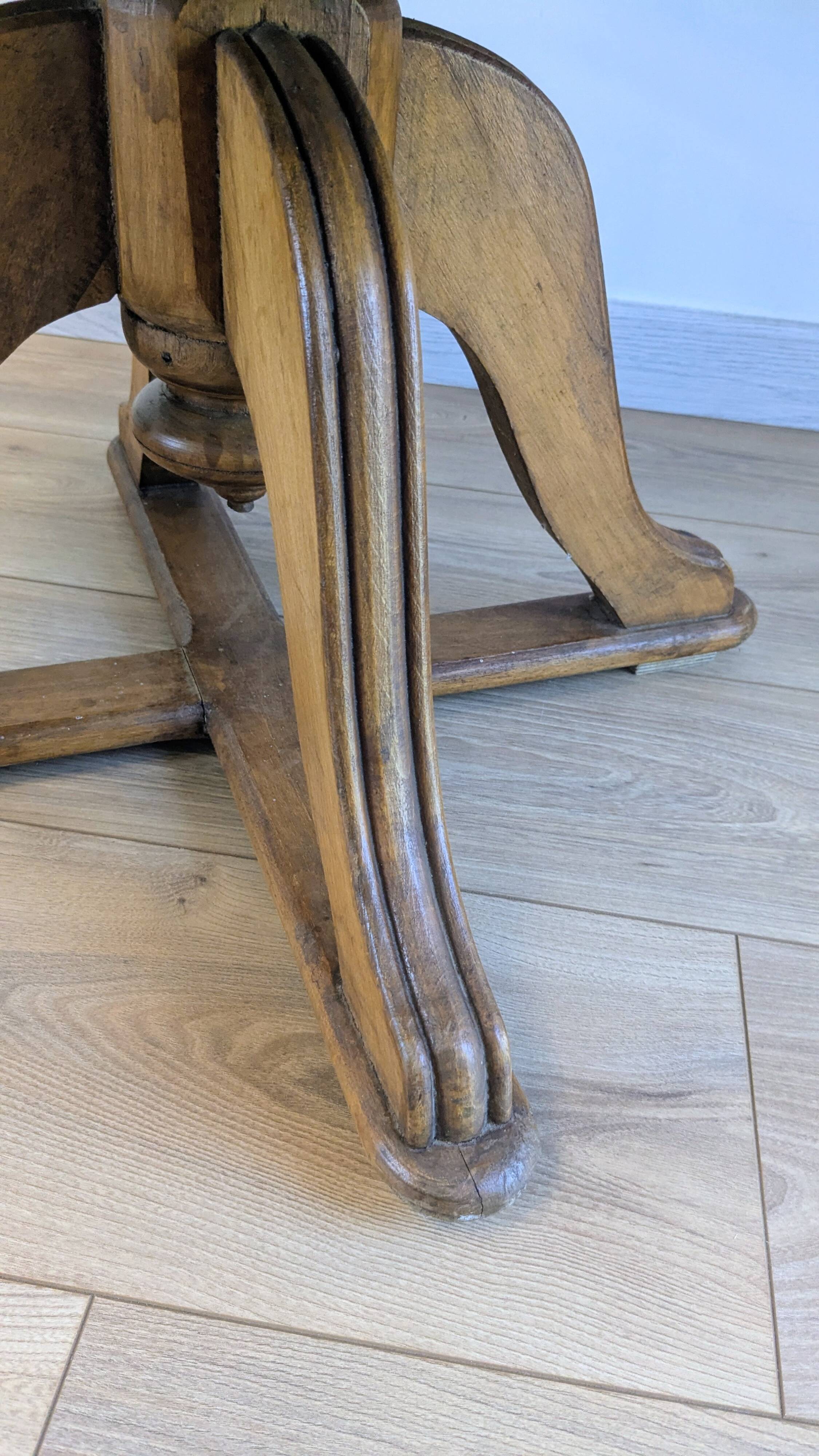 Vintage captain's chair in wood and garnet fabric — a seat with character