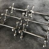 Set of 6 old table knife resistors in the shape of crossbars in silver metal
