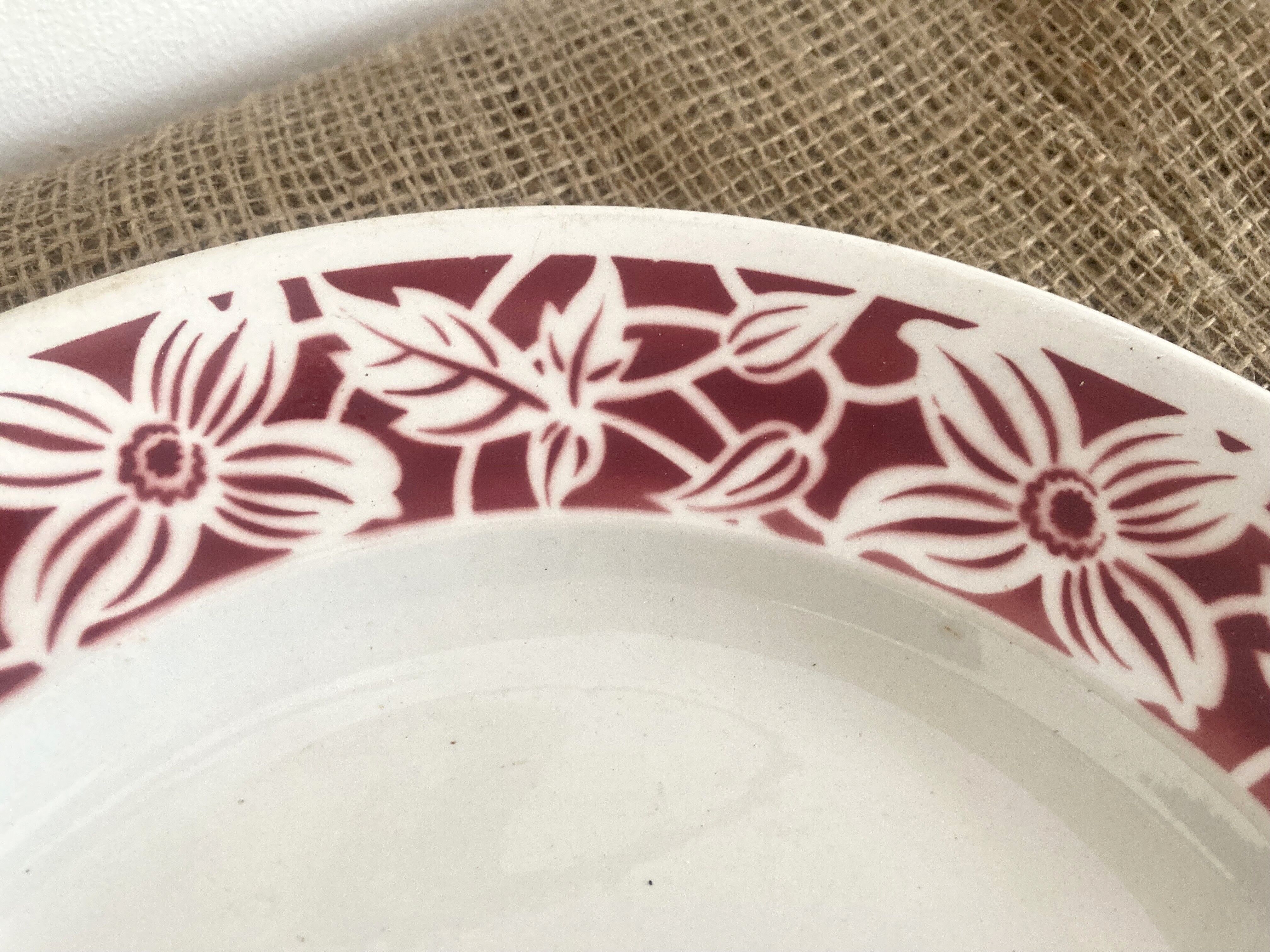 Round serving dish with burgundy red floral pattern