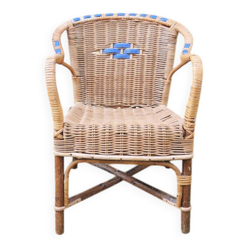 Old wicker chair for children