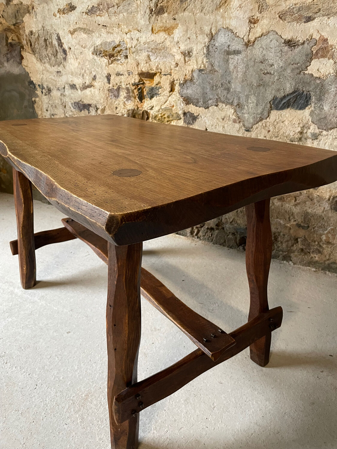Small rustic table made of solid wood.