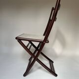 Set de quatre chaises pliantes en bois et cannage