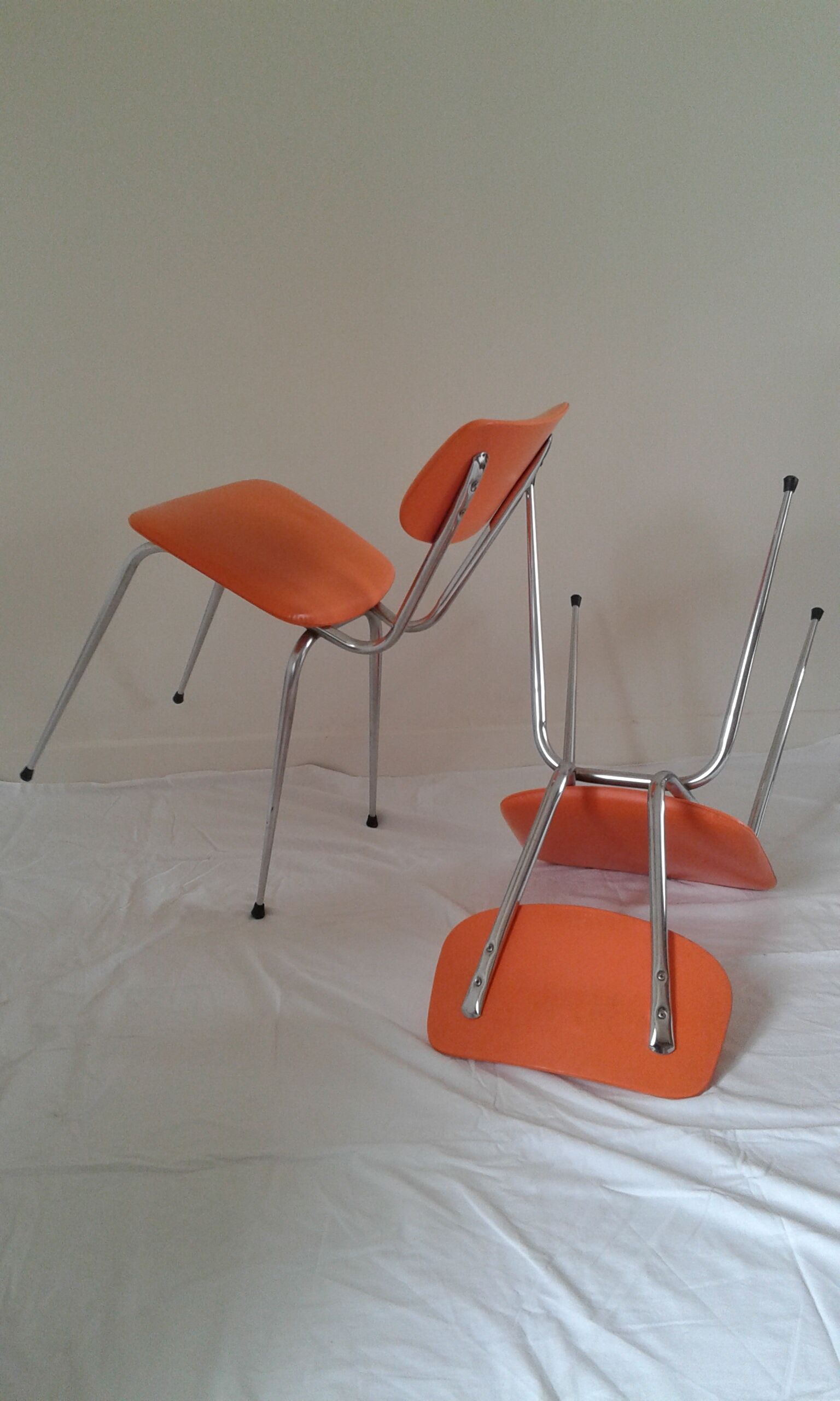 Duo of vintage chairs in orange skai