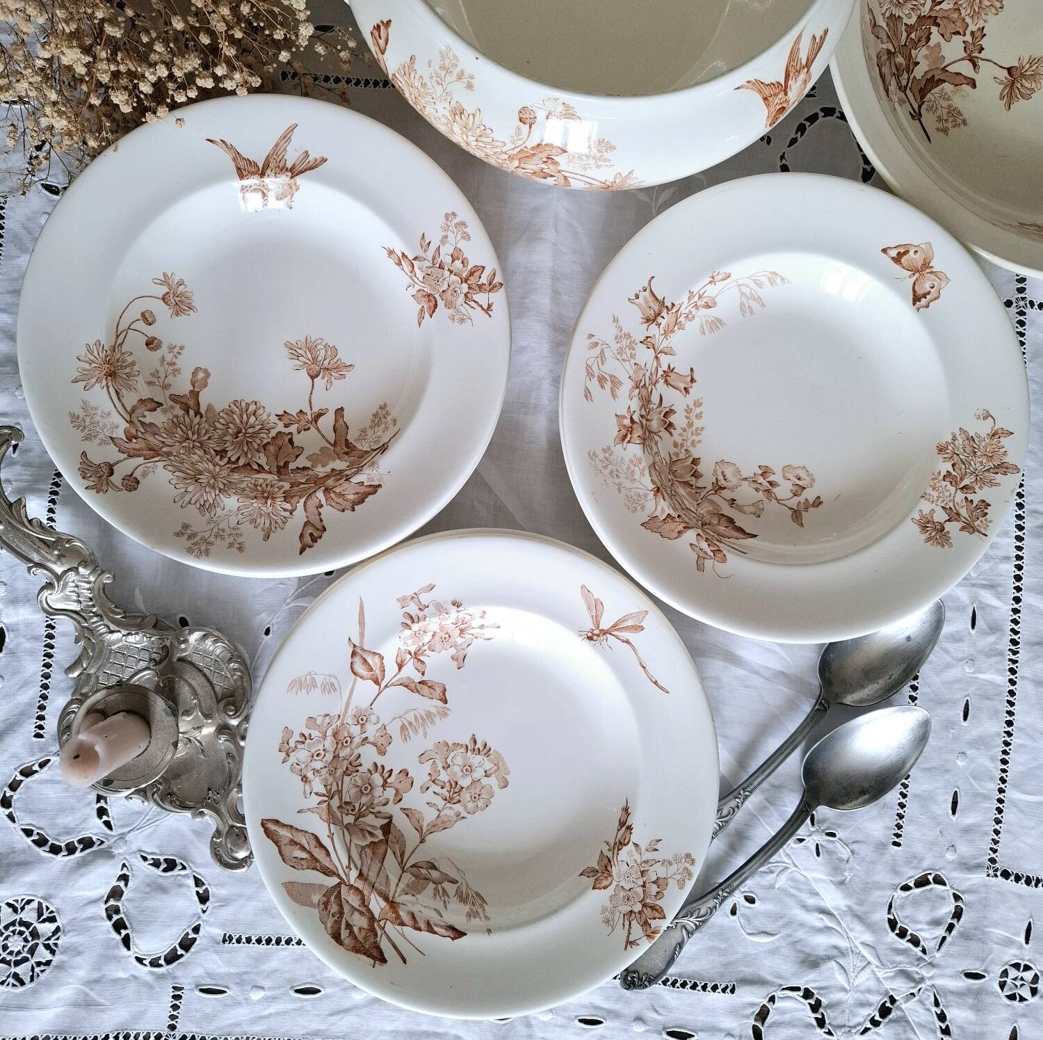 Antique iron earthenware plates accompanied by dishes