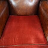 Set of 2 sheep leather wingback chairs with red corduroy seat cushions