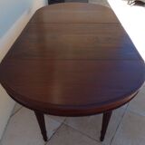 Extendable mahogany table with 6 tapered and fluted legs, Louis XVI style