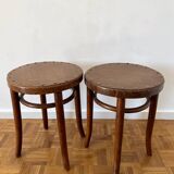 2 antique bistro stools with curved wood and caning effect.