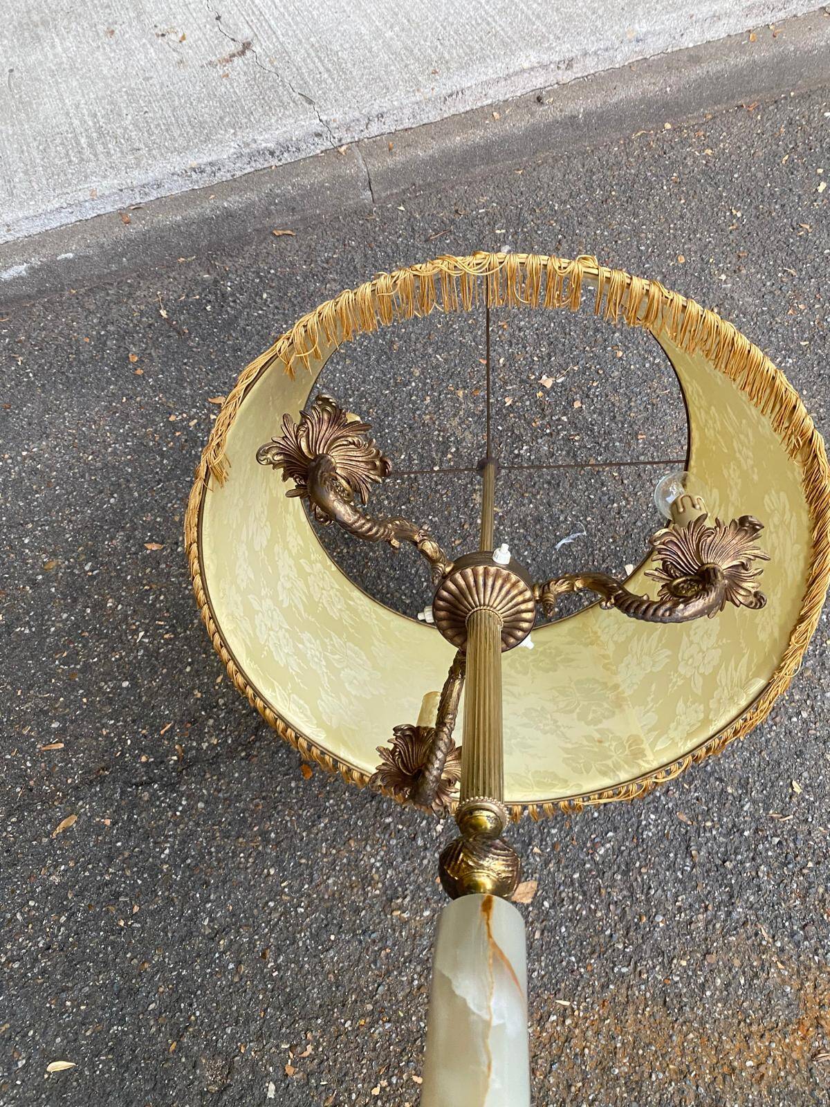 Vintage brass onyx floor lamp with fringed shade.