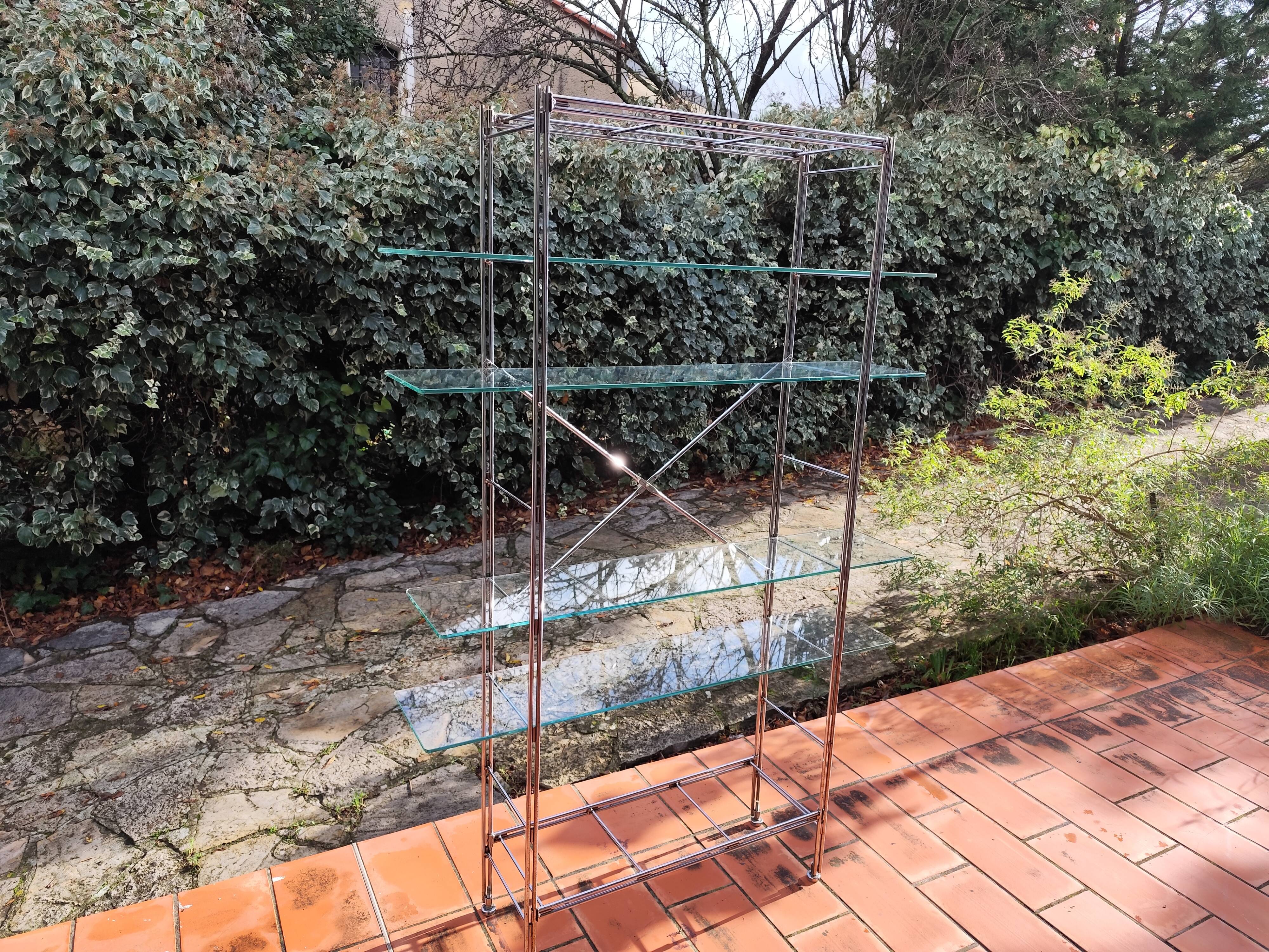 Modular metal chrome and vintage glass shelves from the 1970s.