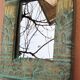 Petit miroir en bois sculpté à patine verte et dorée