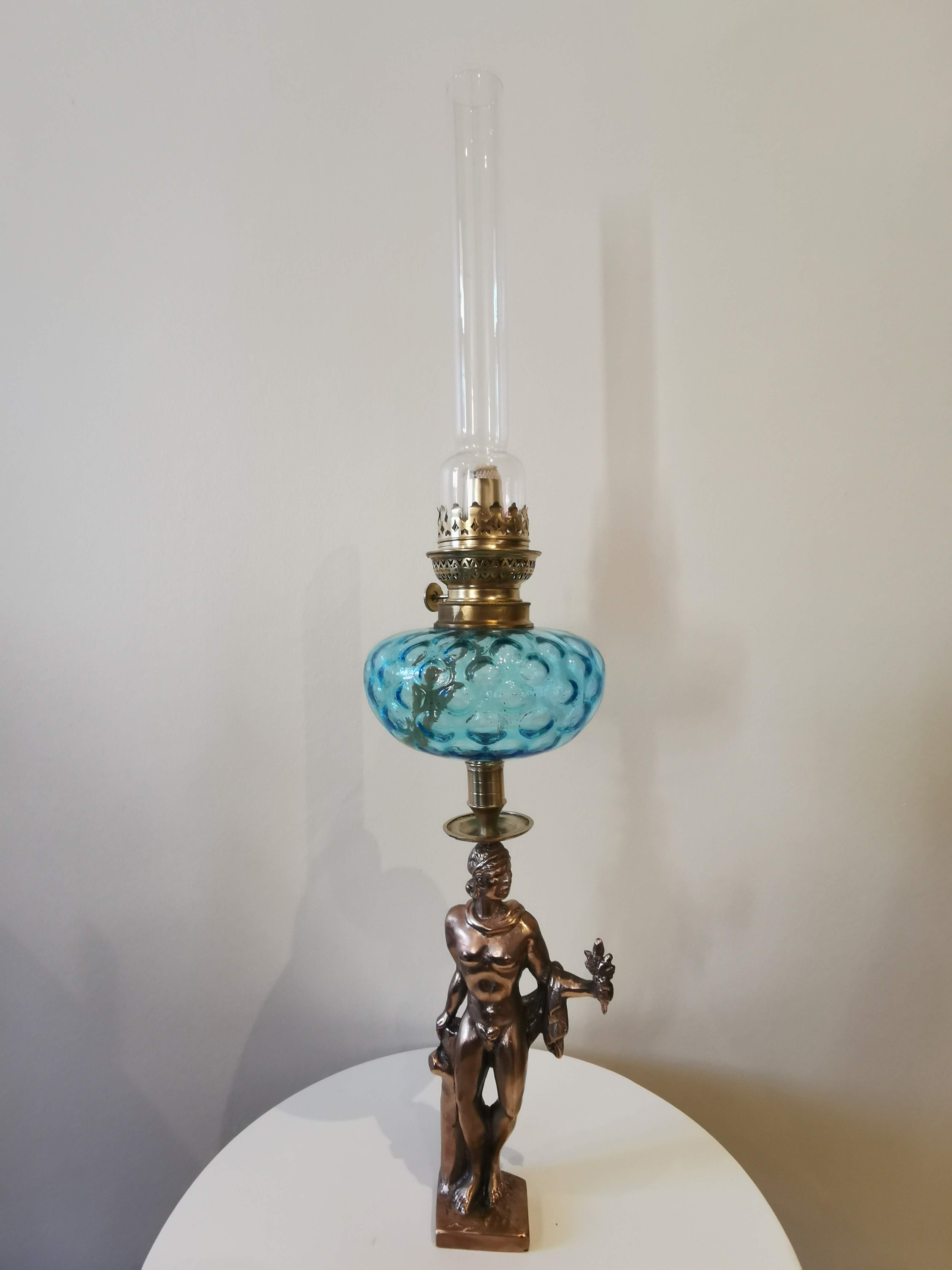 Large kerosene lamp mounted on bronze statue. Late nineteenth century