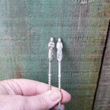 Set of 2 souvenir spoons in silver metal