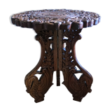 Guéridon en teck sculpté