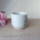 Old ceramic flower cup, vintage bohemian field flowers