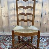 Set of 8 rustic high-back straw chairs.