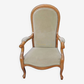 Voltaire style armchair with seat and back in almond green velvet