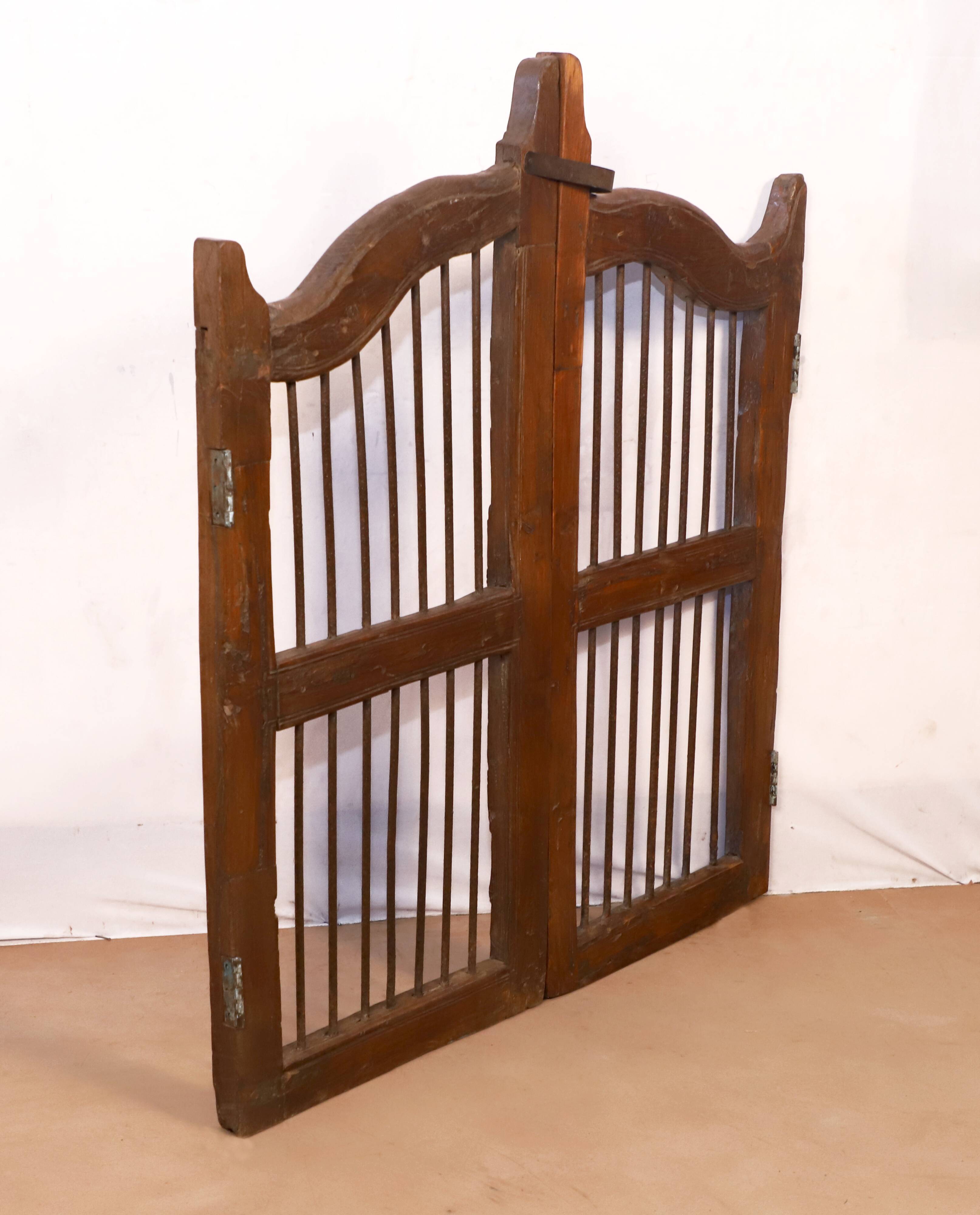 Old Burmese teak gate with openwork wrought iron panels