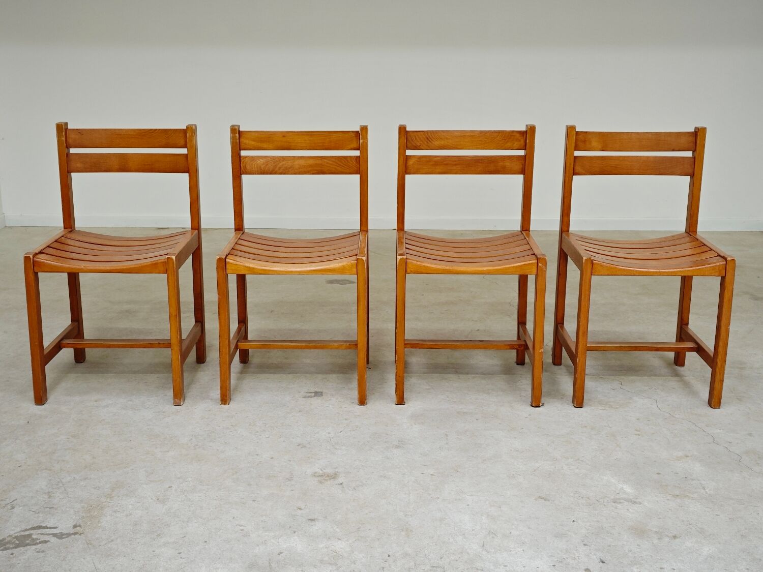 Set of 4 wooden chairs by André Sornay