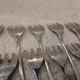 12 silver-plated oyster forks by silversmith J Brille with stick handles.