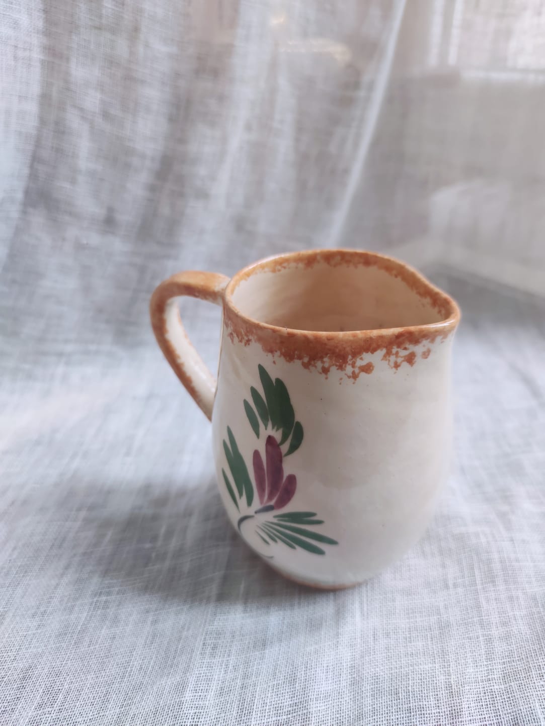 Small hand-painted pitcher