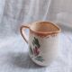 Small hand-painted pitcher