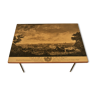 Coffee table - lacquered wooden top decorated with the town of Bayonne - gaudronnés brass feet