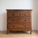 Set of chest of drawers and tall antique furniture in dark oak.