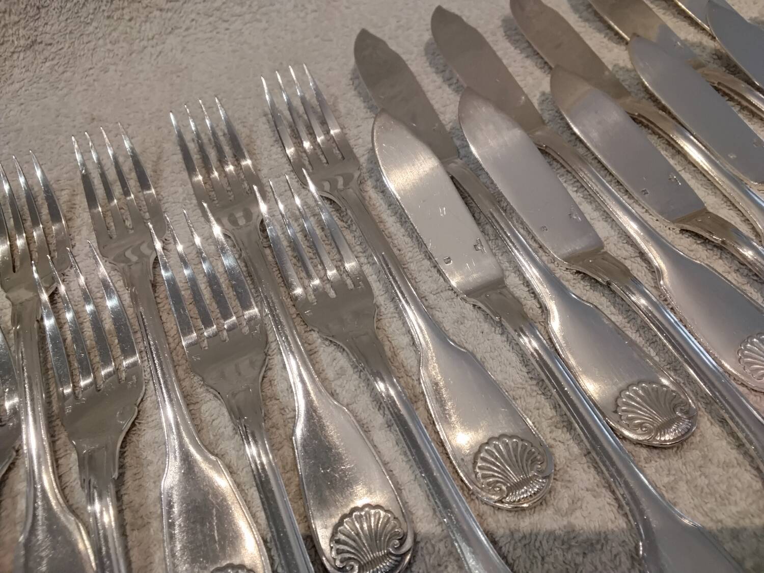 11 silver-plated fish forks and 11 fish knives by Christofle Vendome