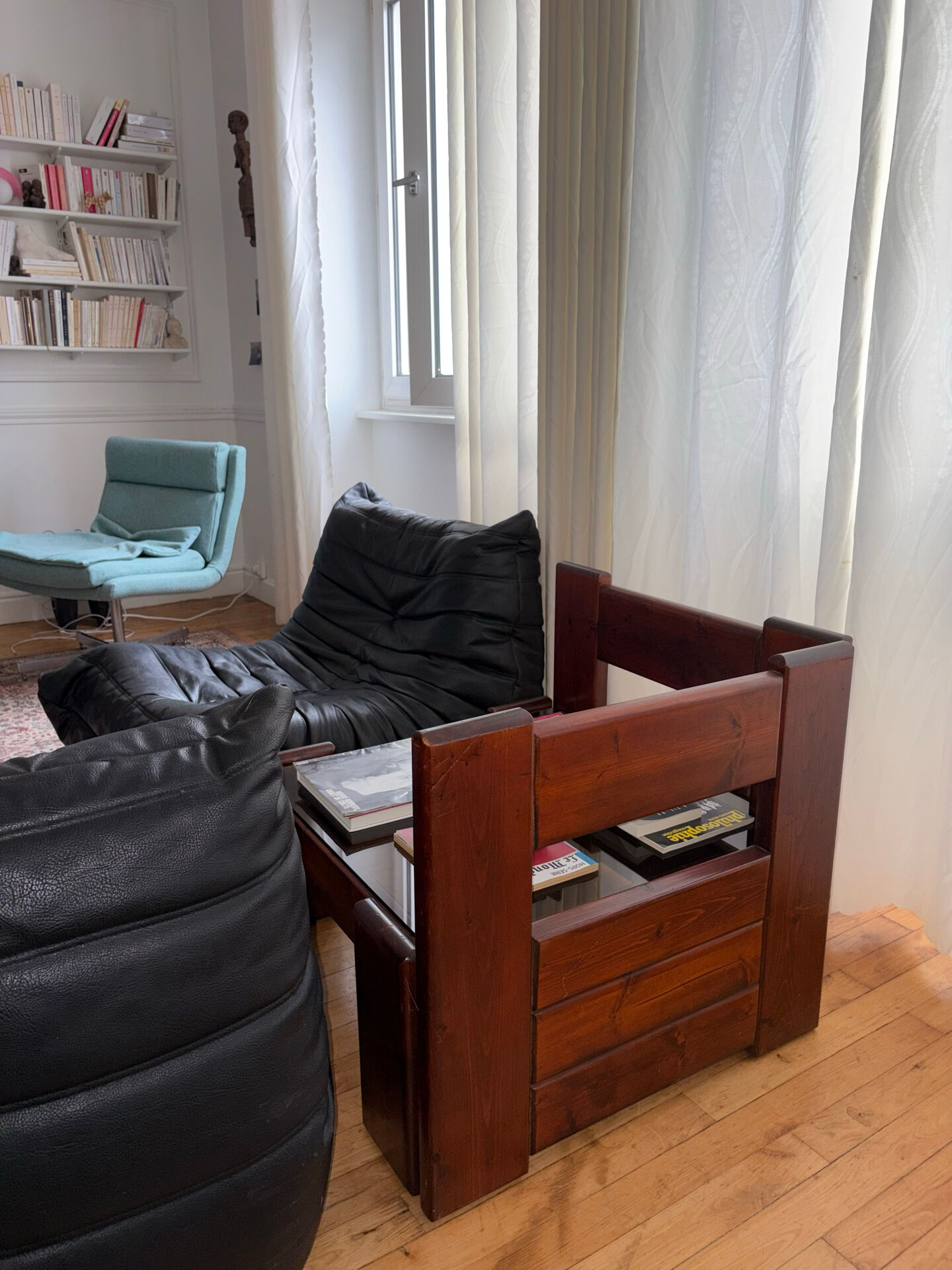 Modernist coffee table in wood and smoked glass.