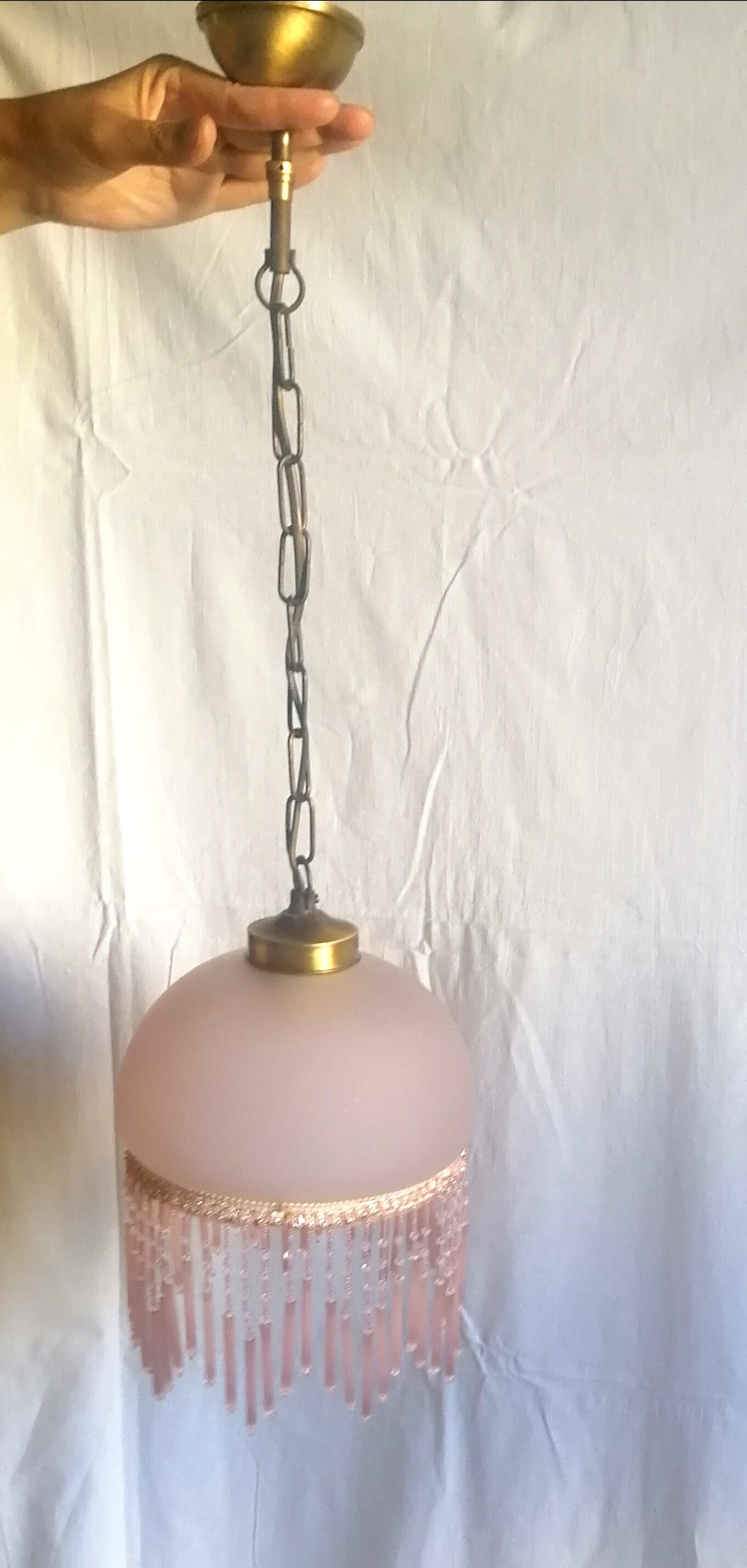Hanging bell and pink glass garland