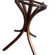 Vintage coat rack on floor in curved wood, thonet style