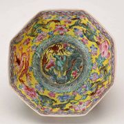 Vintage porcelain bowl decorated with dragons and flowers, China, 1980s.
