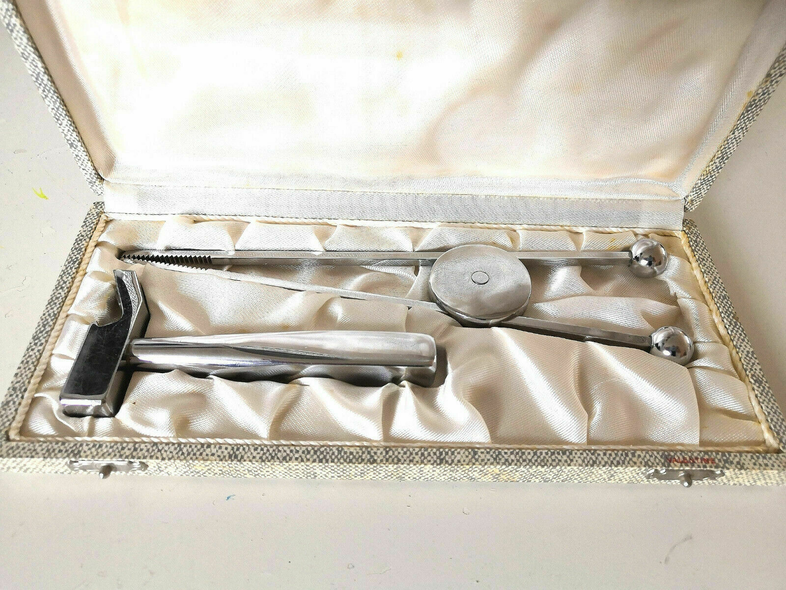 Ice pliers and ice hammer by Jacques Adnet