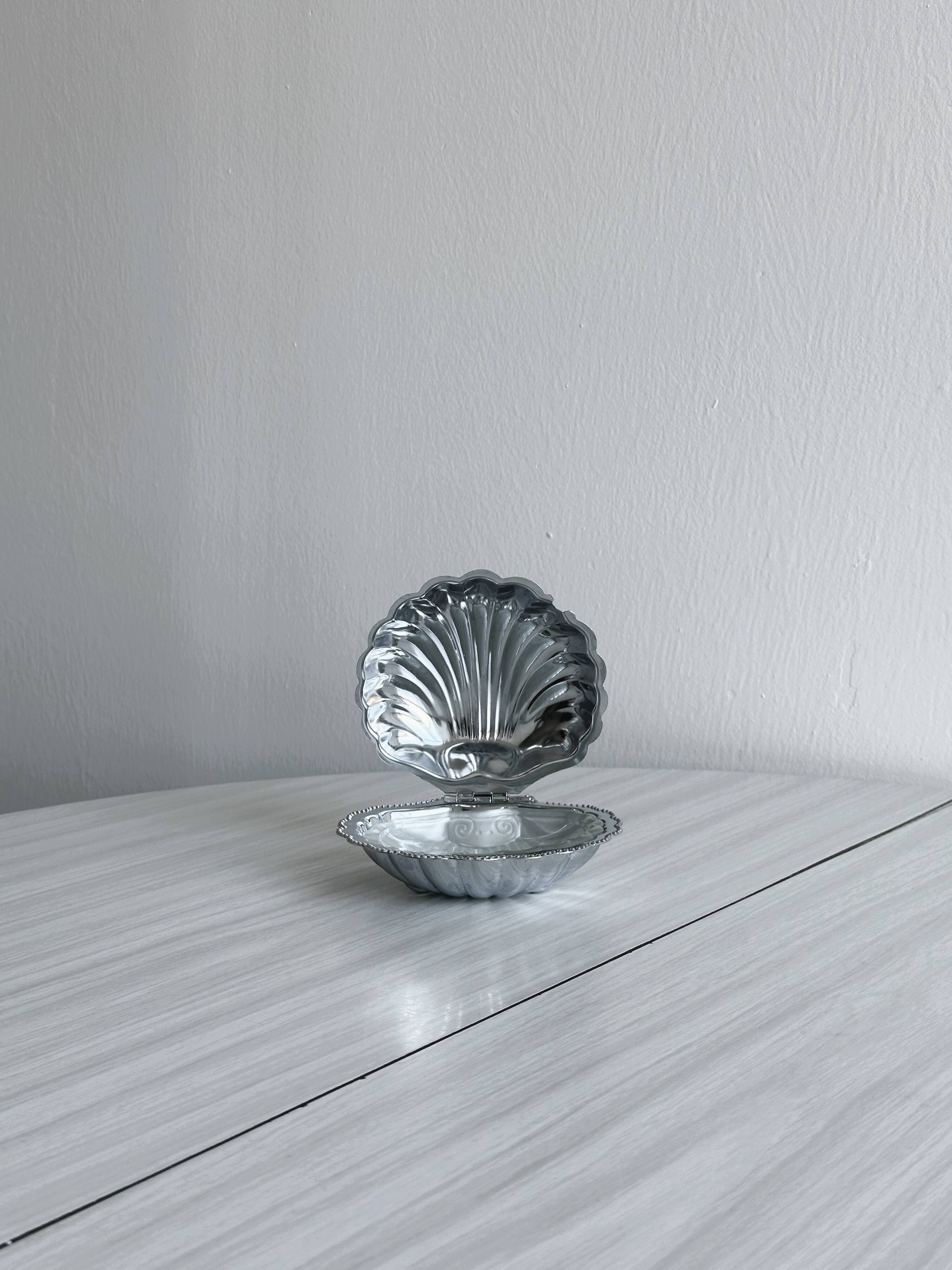 Silver metal butter dish with lid and matching spoon