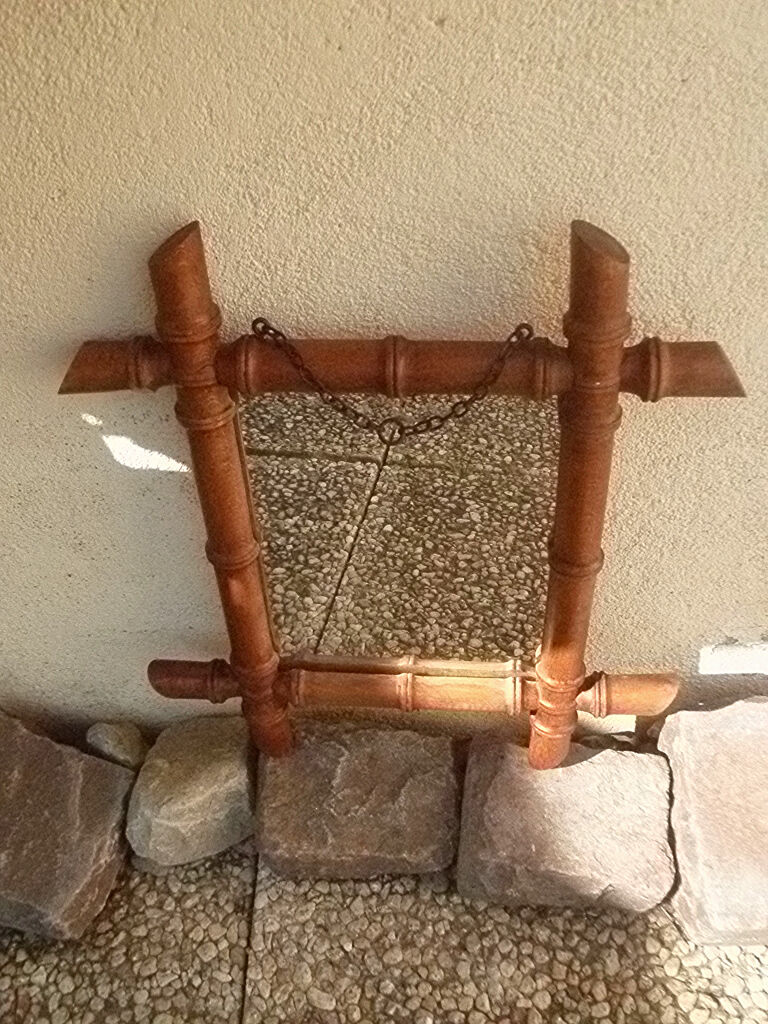 Old wooden mirror, carved bamboo way