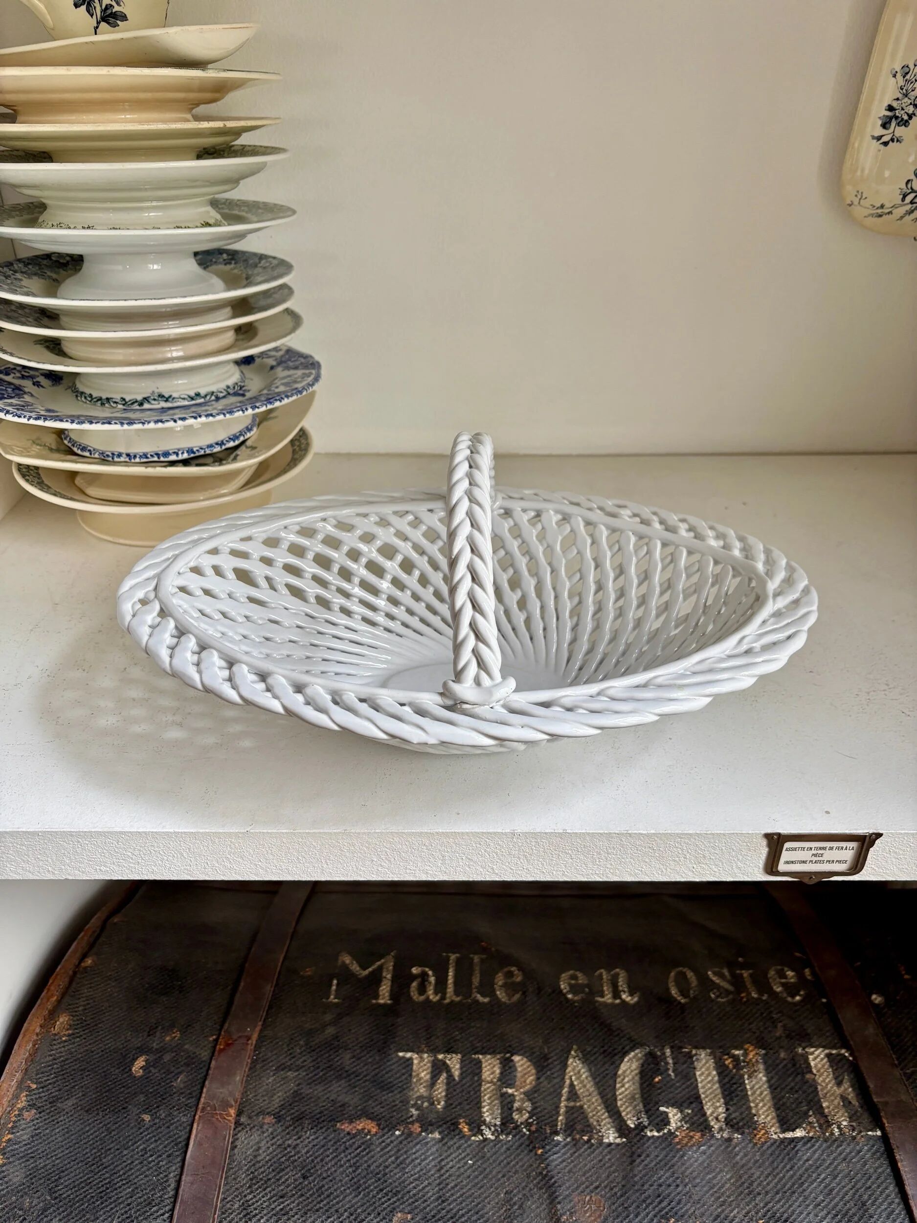 Oval basket in white glazed earthenware