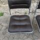 Four vintage chairs from the 1960s and 1970s, chrome with faux leather.