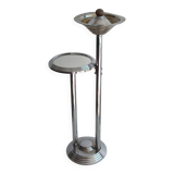 Ashtray and shelf on chrome metal stand.
