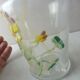 Old enamelled decanter, flower decoration, Legras